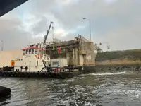 Multicat multipurpose vessel with hydraulic crane & spud pole legs